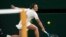 Harmony Tan of France returns a shot during her first round match against Serena Williams of the United States on day two at All England Lawn Tennis and Croquet Club. Photo Credit: Susan Mullane, USA TODAY Sports.