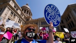 FILE - Abortion rights demonstrators attend a rally at the Texas Capitol, May 14, 2022, in Austin, Texas.
