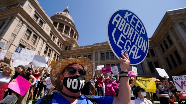 FILE - Abortion rights demonstrators attend a rally at the Texas Capitol, May 14, 2022, in Austin, Texas.