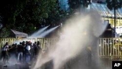 Police use water cannons to disperse protesting students in Colombo, Sri Lanka, July 8, 2022.