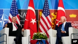 President Joe Biden, right, meets with Turkey's President Recep Tayyip Erdogan during the NATO summit in Madrid, June 29, 2022.