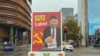 FILE: A truck sponsored by conservative lobby group Advance Australia displaying an image of Chinese President Xi Jinping casting a vote for the Australian opposition Labor Party drives down a local street, April 9, 2022, in the Parramatta area of Sydney.