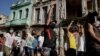 FILE - Protesters shout slogans against the government during a demonstration, which also involved counter-protesters who are in support of the government, in Havana, Cuba July 11, 2021. 