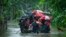 Indian army personnel rescue flood-affected villagers on a boat in Jalimura village, west of Gauhati, India, June 18, 2022.