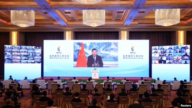 Chinese President Xi Jinping delivers a speech via video at the opening ceremony of the BRICS Business Forum, in Beijing, June 22, 2022. (CNSphoto via Reuters)