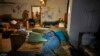 A man sleeps as he hides from Russian shelling in a basement in Lysychansk, Luhansk region, Ukraine, June 16, 2022.