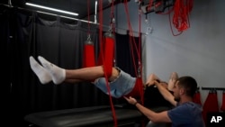 Vladislav Zahorodnii is given rehab massages at a clinic in Kyiv, Ukraine, June 17, 2022.