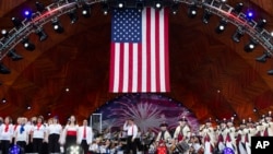 Keith Lockhart, center, conducts during rehearsals for the annual Fourth of July Boston Pops Fireworks Spectacular, July 3, 2022, in Boston, Massachusetts.