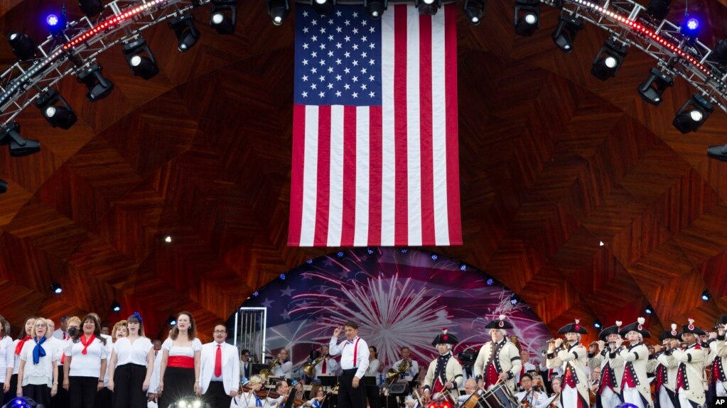 Keith Lockhart, center, conducts during rehearsals for the annual Fourth of July Boston Pops Fireworks Spectacular, July 3, 2022, in Boston, Massachusetts.