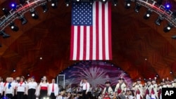 Keith Lockhart, center, conducts during rehearsals for the annual Fourth of July Boston Pops Fireworks Spectacular, July 3, 2022, in Boston, Massachusetts.