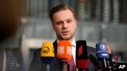 FILE - Lithuanian Foreign Minister Gabrielius Landsbergis speaks with the media at a meeting of NATO foreign ministers in Brussels, April 6, 2022.