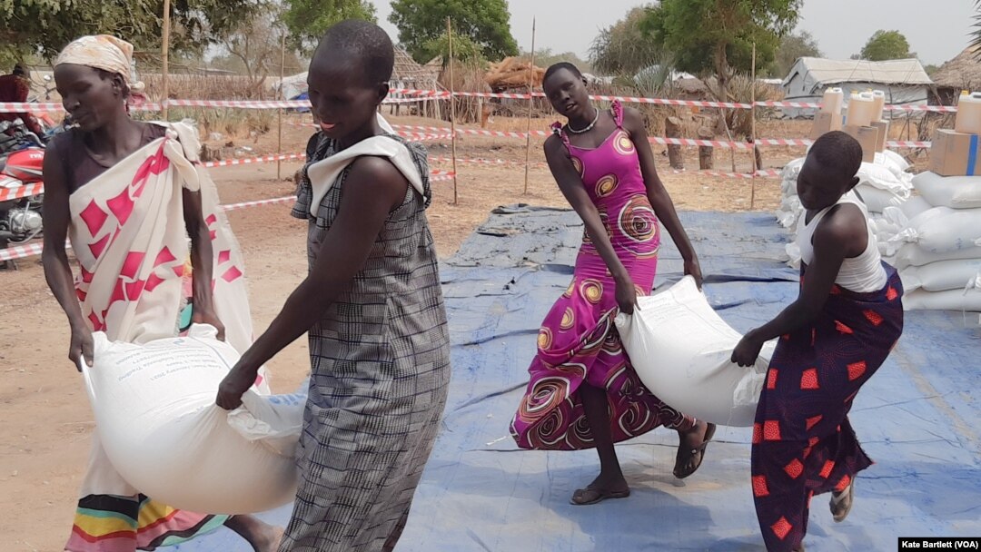 FILE: Displaced people in Bor, South Sudan, collect food aid last month. Taken 02.21.2022