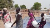 FILE: Displaced people in Bor, South Sudan, collect food aid last month. Taken 02.21.2022