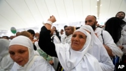 Muslim pilgrims cast stones in the symbolic stoning of the devil ritual during the Hajj pilgrimage, in Mina near the city of Mecca, Saudi Arabia, July 9, 2022.