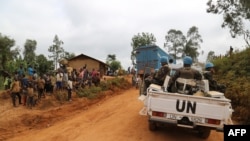 FILE - In this photograph taken on March 13, 2020, soldiers from the U.N. mission in DRC (Monusco) ride in a vehicle as they patrol in the violence-torn Djugu territory, Ituri province, eastern Democratic Republic of Congo.