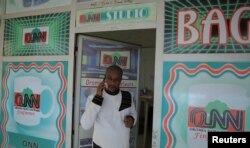 File - Dessu Dulla, The Ethiopian Journalist Working For The Oromia News Network, Speaks On His Cell Phone Outside His Studios In Addis Ababa, Ethiopia May 25,