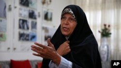 FILE - Faezeh Hashemi, the activist daughter of Iran's late President Akbar Hashemi Rafsanjani, speaks during an interview in Tehran, Iran, Sept. 6, 2018.