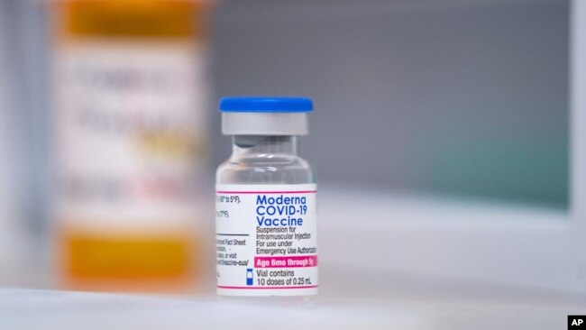 A vial of the Moderna COVID-19 vaccination for children under 5 sits on a counter at Walgreens pharmacy Monday, June 20, 2022, in Lexington, S.C.