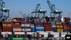 FILE: Cargo containers sit stacked at the Port of Los Angeles, on Oct. 20, 2021, in San Pedro, Calif. On June 29, 2023 the U.S. Commerce Departyment upwardly revised first-quarter GDP to 2%.