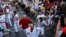 Revelers run during the running of the bulls at the San Fermin festival in Pamplona, Spain, July 7, 2022.