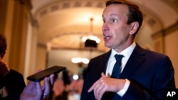 Sen. Chris Murphy, D-Conn., who has led the Democrats in bipartisan Senate talks to rein in gun violence, pauses for questions from reporters, at the Capitol in Washington, June 22, 2022.