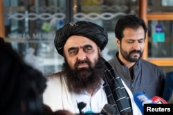 FILE - Acting Foreign Minister of Taliban Amir Khan Muttaqi gives statements to the press outside the Soria Moria hotel in Oslo, Jan. 24, 2022. (NTB/Terje Pedersen via Reuters)