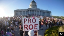 FILE - People attend an abortion-rights protest at the Utah State Capitol in Salt Lake City after the Supreme Court overturned Roe v. Wade, Friday, June 24, 2022. (AP Photo/Rick Bowmer)