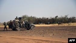 FILE: A detachment of anti-jihadist Special Forces elements "Almahaou" (Tourbillon) patrol on November 6, 2021 in the Tillaberi region (western Niger), the scene of deadly actions by suspected jihadists since the beginning of the year