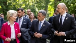 Swiss President Ignazio Cassis talks to European Commission President Ursula von der Leyen and Ukrainian Prime Minister Denys Shmyhal, during the Ukraine Recovery Conference in Lugano, Switzerland, July 4, 2022.