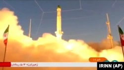 In this frame grab from video footage released Sunday, June 26, 2022 by Iran state TV, IRINN, shows an Iranian satellite-carrier rocket, called 'Zuljanah,' blasting off from an undisclosed location in Iran. (IRINN via AP)