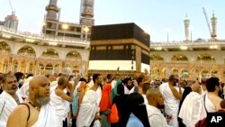 Thousands of Muslim pilgrims circumambulate around the Kaaba, the cubic building at the Grand Mosque, in the Saudi Arabia's holy city of Mecca, Tuesday, July 5, 2022. (AP Photo/Amr Nabil)