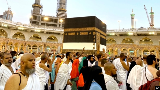 Thousands of Muslim pilgrims circumambulate around the Kaaba, the cubic building at the Grand Mosque, in the Saudi Arabia's holy city of Mecca, Tuesday, July 5, 2022. (AP Photo/Amr Nabil)