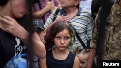 People wait to board a train to Dnipro and Lviv during an evacuation effort from war-affected areas of eastern Ukraine, amid Russia's invasion of the country, in Pokrovsk, Donetsk region, Ukraine, June 18, 2022.