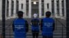 Activist set up a mock Uyghur forced labor camp outside the Apple flagship store on March 4, 2022, in Washington.