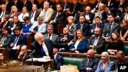 In this photo provided by U.K. Parliament, Britain's Prime Minister Boris Johnson speaks during Prime Minister's Questions in the House of Commons in London, July 6, 2022. 