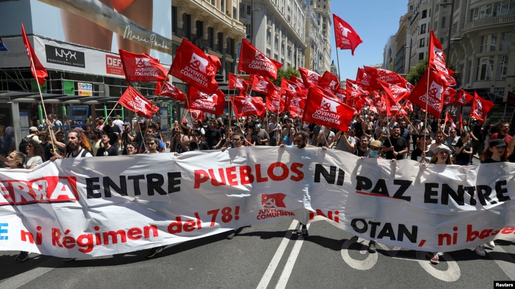 Demonstrators take part in an anti-NATO protest ahead of the NATO summit, which will be held on June 28 and June 30 in Madrid, Spain, June 26, 2022. 
