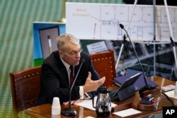 Using a diagram of Robb Elementary School in Uvalde, Texas, Texas Department of Public Safety Director Steve McCraw testifies at a Texas Senate hearing at the state capitol, June 21, 2022, in Austin, Texas.