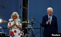 U.S. President Joe Biden and first lady Jill Biden hold a moment of silence for the victims of the mass shooting in the Chicago suburb of Highland Park, Illinois, during an Independence Day celebration on the South Lawn of the White House in Washington, July 4, 2022.