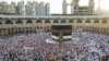 Muslim worshippers gather before the Kaaba at the Grand Mosque in Saudi Arabia's holy city of Mecca, Saudi Arabia, July 2, 2022. 