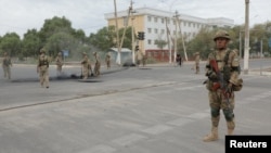 Uzbek service members are seen on patrol in Nukus, capital of the northwestern Karakalpakstan region, Uzbekistan, July 3, 2022. (KUN.UZ/Handout via Reuters) 