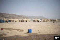 FILE - A water jug is seen at the internally displaced persons camp of Guyah, Afar region, Ethiopia, May 17, 2022.