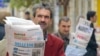 FILE - Azeri street vendors sell papers in downtown Baku, in November 2005. In the years since, the country’s print media have almost disappeared, but Azerbaijan is seeing a growth in online media. 