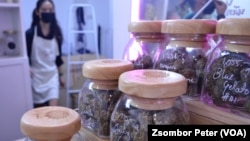 Jars of dried and cured cannabis buds sit on display at the Chopaka cannabis shop in Bangkok, Thailand.