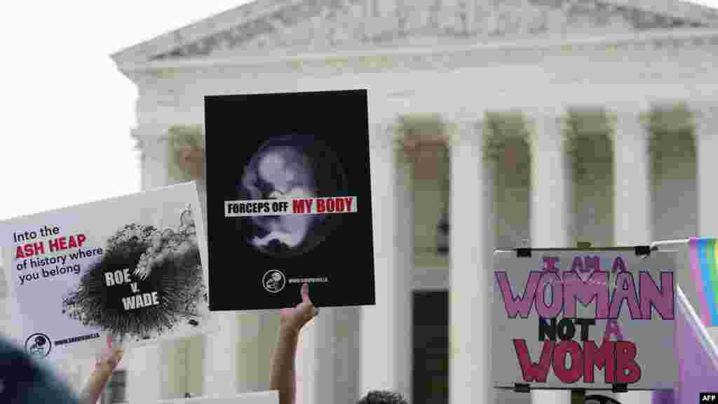 Anti-abortion and abortion-rights are seen outside the US Supreme Court in Washington.
