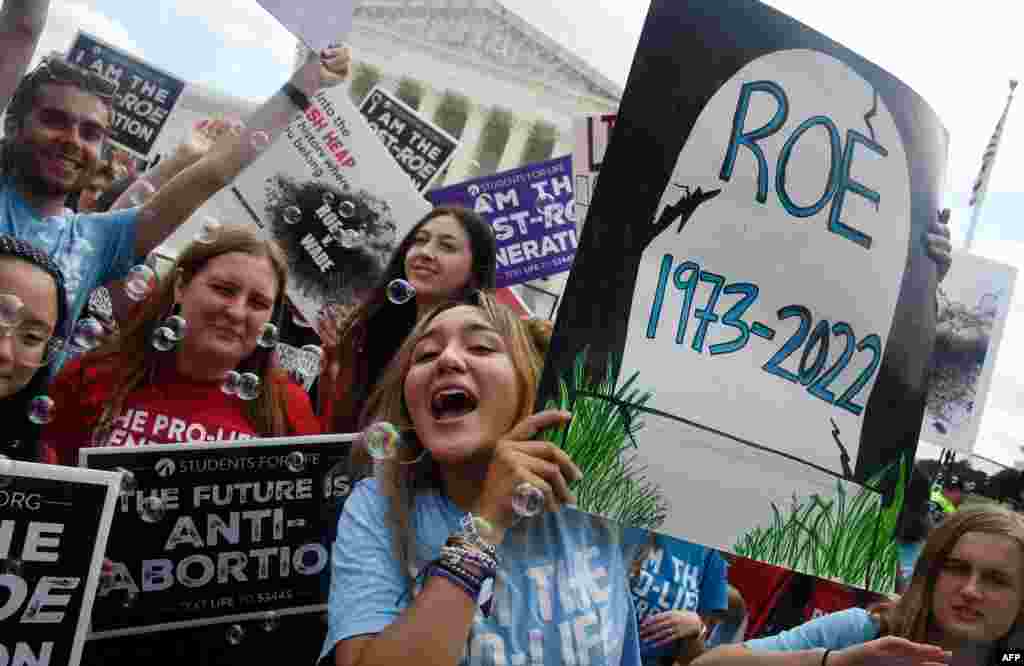 Anti-abortion campaigners celebrate outside the U.S. Supreme Court in Washington.