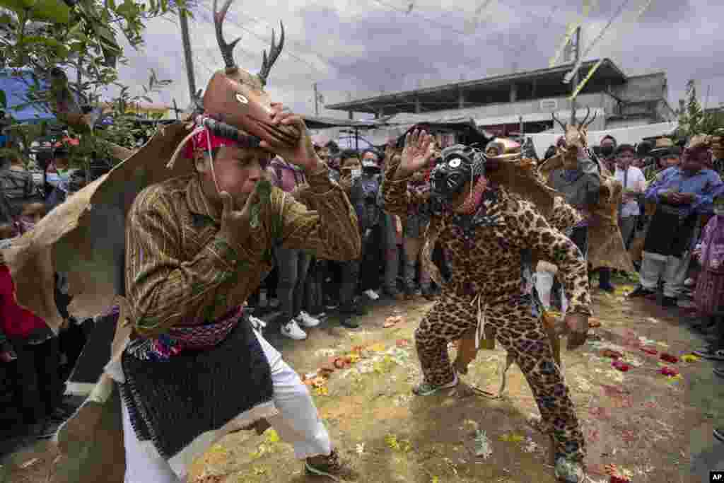 Indigenous dancers perform &#39;The Dance of the Deer&#39; during the Corpus Christi celebration in the Kaqchikel Indigenous town of Patzun, Guatemala, June 19, 2022.