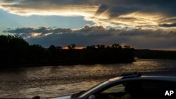 A motorist crosses the Yellowstone River in Columbus, Mont., June 17, 2022. 
