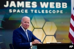 President Joe Biden listens during a briefing from NASA officials in the South Court Auditorium on the White House complex, July 11, 2022.