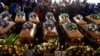 A view of some of the coffins during a funeral in Scenery Park, East London, South Africa, July 6, 2022. The service was for 21 teens who died in a mysterious tragedy at a nightclub nearly two weeks ago.
