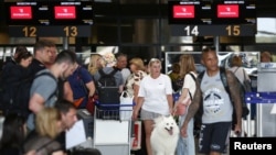 Russian embassy employees and family members depart, after the Bulgarian government's decision to expel 70 Russian diplomatic staff, at Sofia airport, Bulgaria, July 3, 2022.